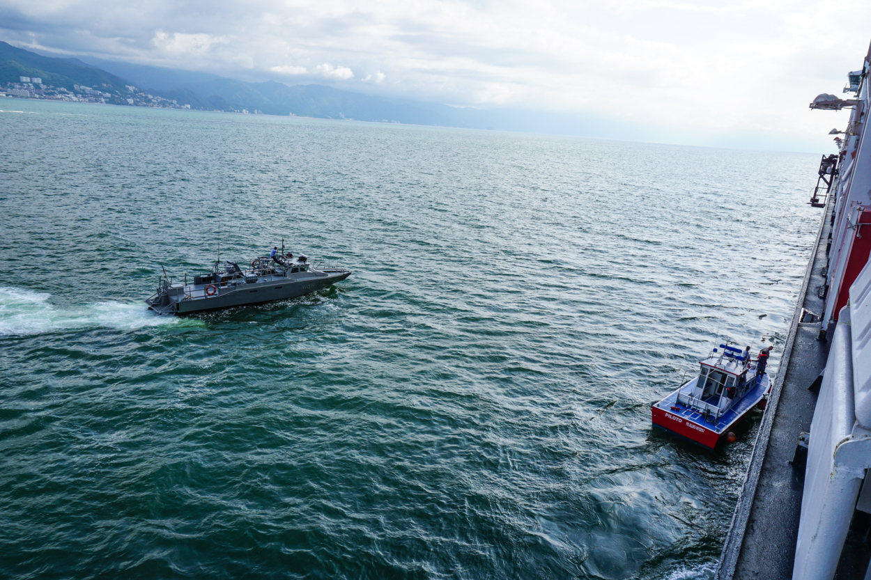 4 Support boat pulls alongside... just in case she goes in the water